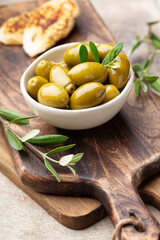 Green olives on gray background.