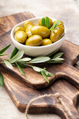 Green olives on gray background.