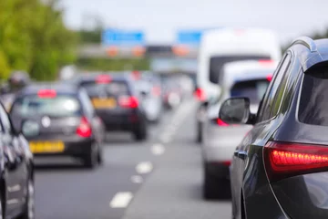 Foto op Plexiglas Traffic jam congestion with rows of cars on highway or motorway in rush hour © Brian Jackson