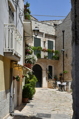 A small street in Casamassima, a village with blue-colored houses in the Puglia region of Italy.