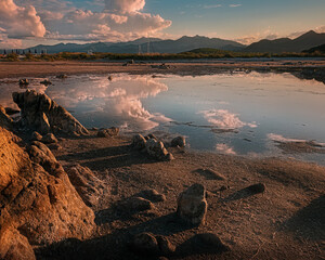 clouds and sea rocks reflections