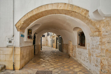 A small street in Casamassima, a village with blue-colored houses in the Puglia region of Italy.