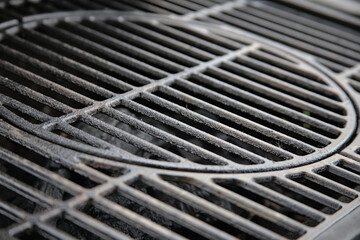 close up of metal grill with coals