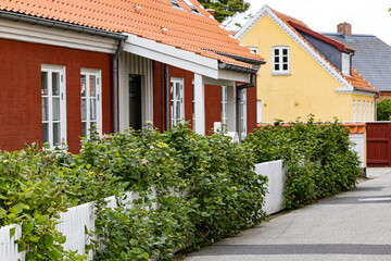 Fototapeta na wymiar Skagen, Denmark The cute back streets of the village with yellow and red houses.