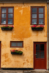 Fototapeta na wymiar Hjorring, Denmark The orange facade of an old building.