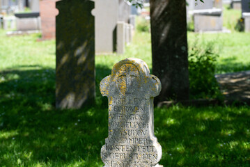 Den Helder, Netherlands, June 2022. Old dilapidated graves in the cemetery of Den Helder.
