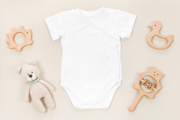 White wrap bodysuit for baby mocap. Mockup of children's clothes on a pastel brown background with...