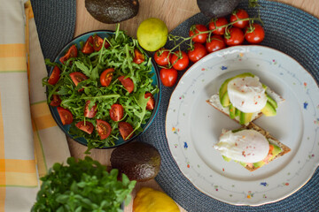 Poached Egg Benedict Toast with Avocado, Salmon and Rucola.