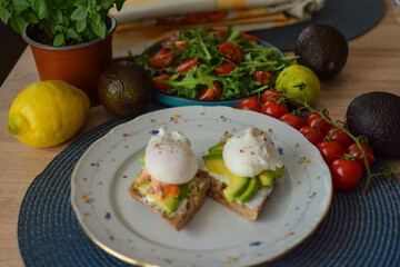 Poached Egg Benedict Toast with Avocado, Salmon and Rucola.