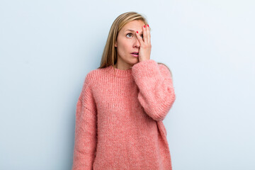 young adult blonde pretty woman feeling bored, frustrated and sleepy after a tiresome, dull and...