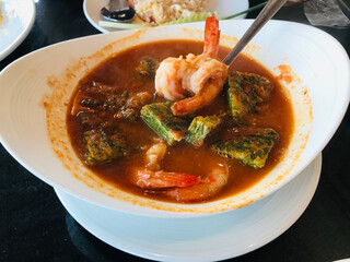 Thai cuisine...Senegalia pennata omelette and shrimps in sour curry soup.