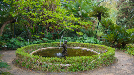 fountain in the beautiful historical botanical garden of the Conception of Malaga, Andalucia, Spain