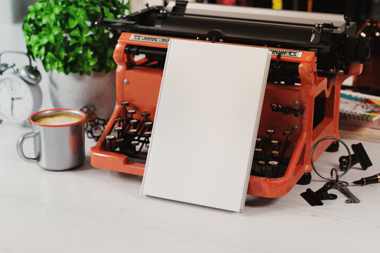 Hardcover Book Near Old Typewriter Mockup