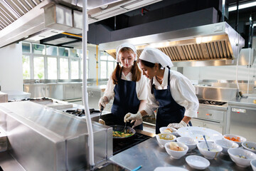 Group of student girl learning. Cooking class. culinary classroom. group of happy young woman multi...