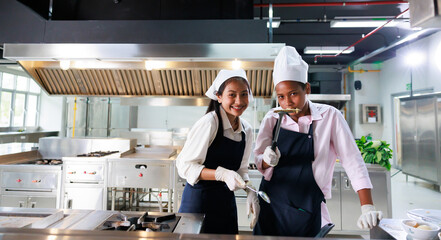 Group portrait young wman cooking student. Cooking class. culinary classroom. group of happy young woman multi - ethnic students are focusing on cooking lessons in a cooking school.