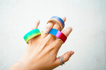 Hand holding a mix of colorful washi tapes