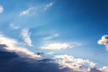 clouds on the blue sky in morning light. stormy weather approaching in summer
