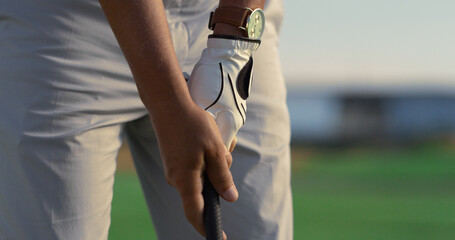 Golf player hands swing hold putter club on green course. Man play sport outside