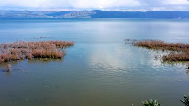 Aerial Panning Forward Scenic Shot Of Sea Of Galilee By Mountains - Kinneret, Israel