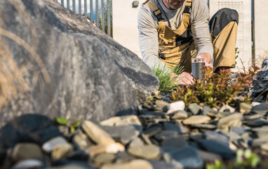 Landscaping Contractor Installing LED Outdoor Garden Lamp