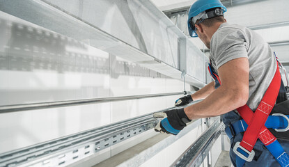 Professional Industry Worker Installing Aluminium Runner