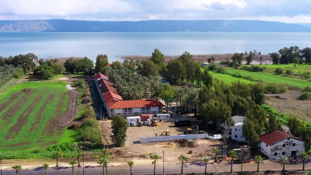 Aerial Panning Shot Of Guesthouses By Lake Kinneret
