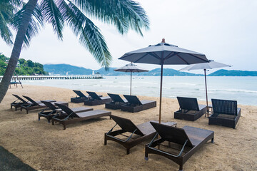 Beach Chairs in front of the sea beach - Holiday relaxation background Concept
