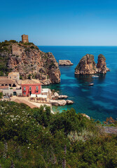 Fototapeta na wymiar Scopello - one of the most beautiful places in Sicily, Italy. Visit card of the Mediterranean with crystal clear sea and amazing rock formations. 