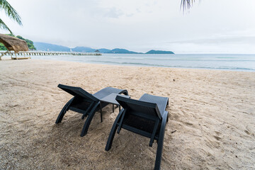 Beach Chairs in front of the sea beach - Holiday relaxation background Concept