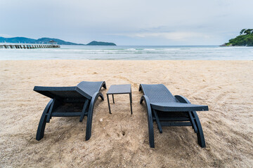 Beach Chairs in front of the sea beach - Holiday relaxation background Concept