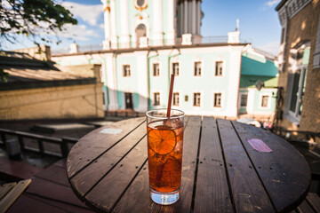 Aperol cold drink in glass at sunny day in historical Ukrainian capital, Kyiv.