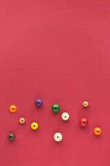 flat lay composition with decorative baubles folk beads and  space for text  on red background