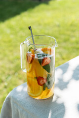 Decanter with summer lemonade close up