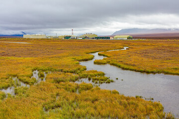 Pump station of the Trans Alaska Pipeline System on the tundra of the North Slope in autumn colors,...