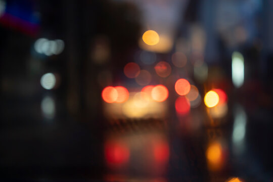 night traffic blur background. Rain and bad wet weather