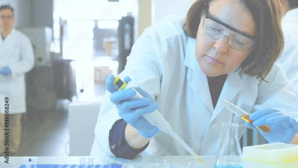Poster animation of red shapes over diverse scientists in lab