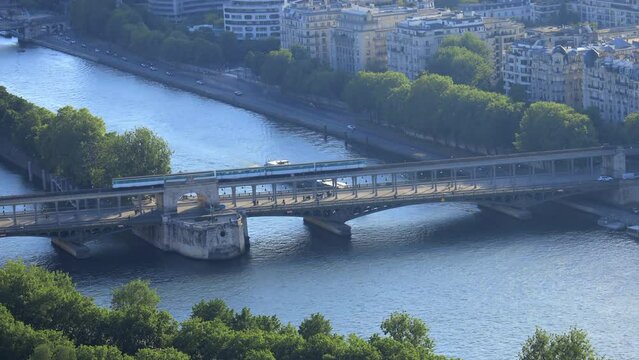 metro passing on the Bir Hakeim bridge in Paris France on a beautiful Spring day seen from the Eiffel Tower