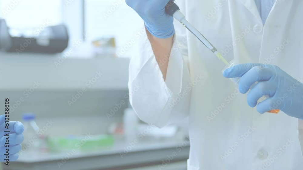 Poster animation of red shapes over diverse scientists in lab