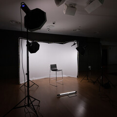 Fototapeta na wymiar Filming set with lights, cameras and white background.