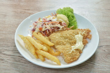 batter fried dolly fish wrapped bread steak with salad on dish