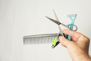 scissors and comb on a light background