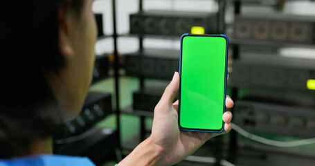 asian investor showing his phone