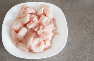 raw chicken wings on a plate