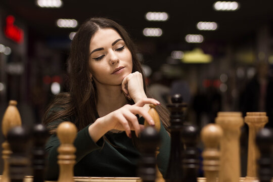 beautiful girl playing chess