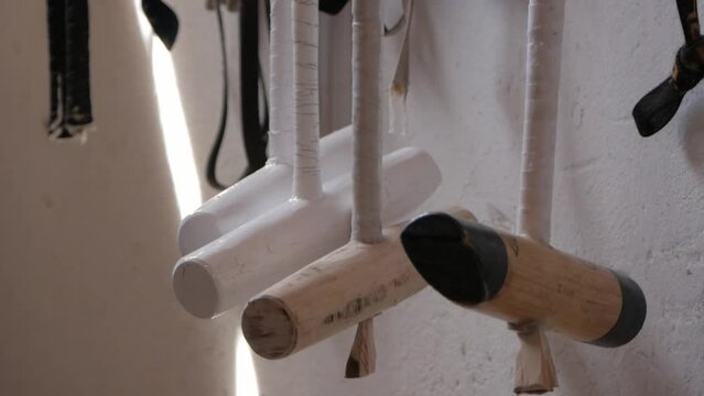 Close Up Of Wooden Polo Mallet Head Hung Inside The Stable. Horse Polo Equipment.