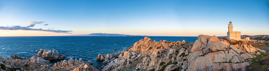 Panoramic tranquil scenery with lighthouse at Capo Testa Sardinia at sunset