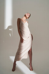 Beautiful woman pose in studio in classic dress - 510604012