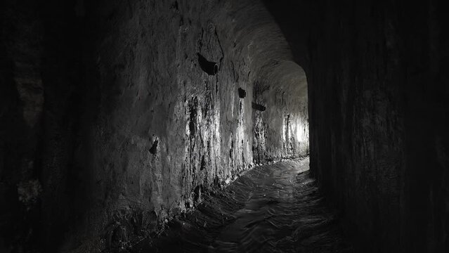 Wet underground arch sewer collector. Old arch dungeon.