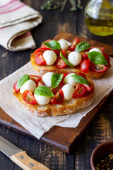 Bruschetta with mozzarella, tomatoes and basil. Vegetarian food. Healthy eating.
