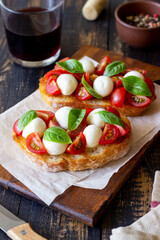 Bruschetta with mozzarella, tomatoes and basil. Vegetarian food. Healthy eating.